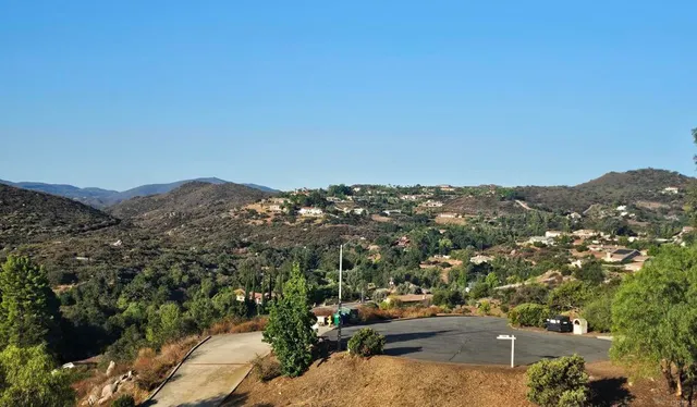 a view of a large building with a mountain in the background