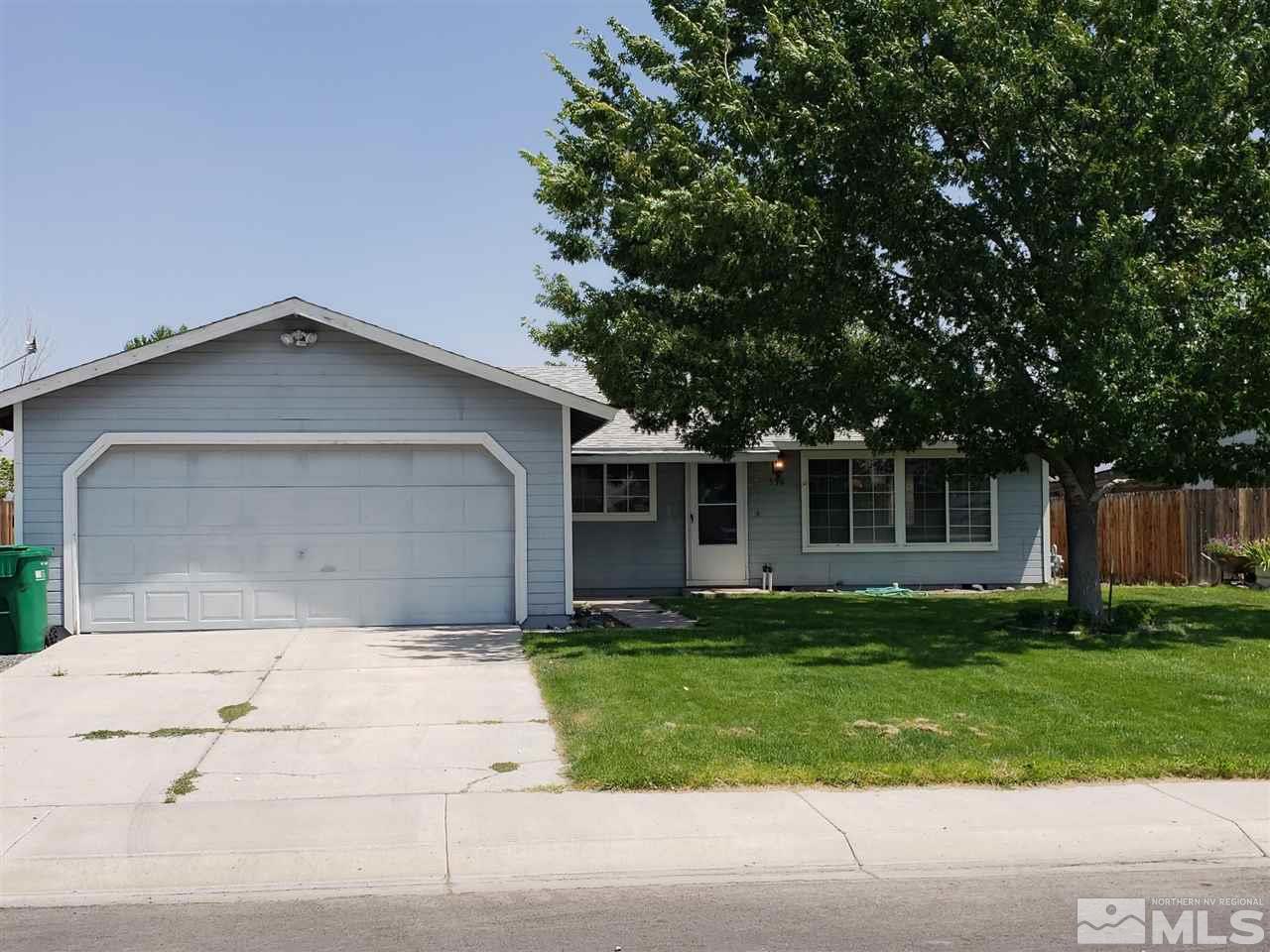 536 Yellow Jacket Road Dayton, NV 89403 - Photo 1 of 7 a front view of a house with a garden and trees