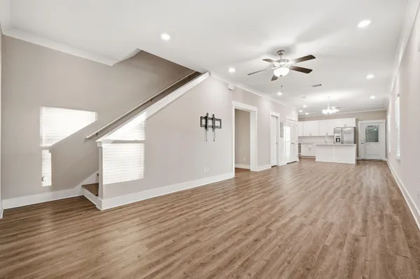 a view of an empty room and wooden floor