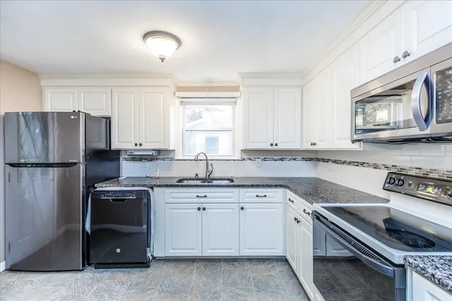 a kitchen with a sink stove and refrigerator
