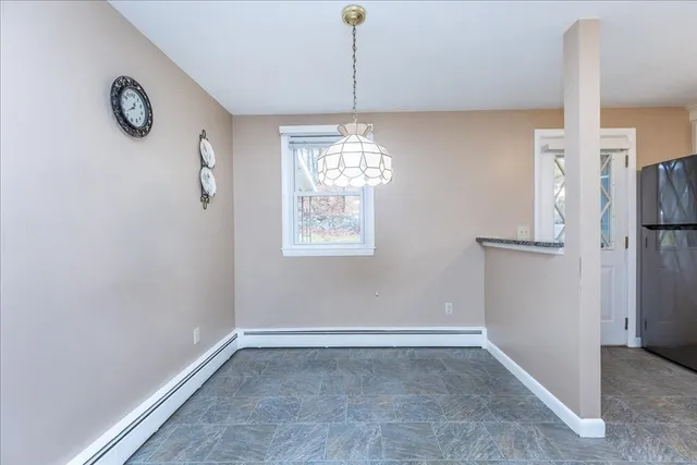a view of a room with window and cabinet
