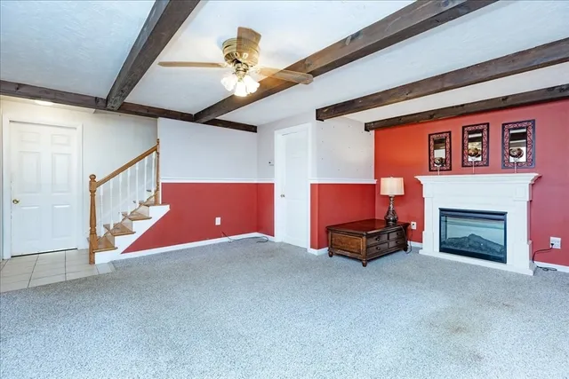 a room with furniture and a fireplace