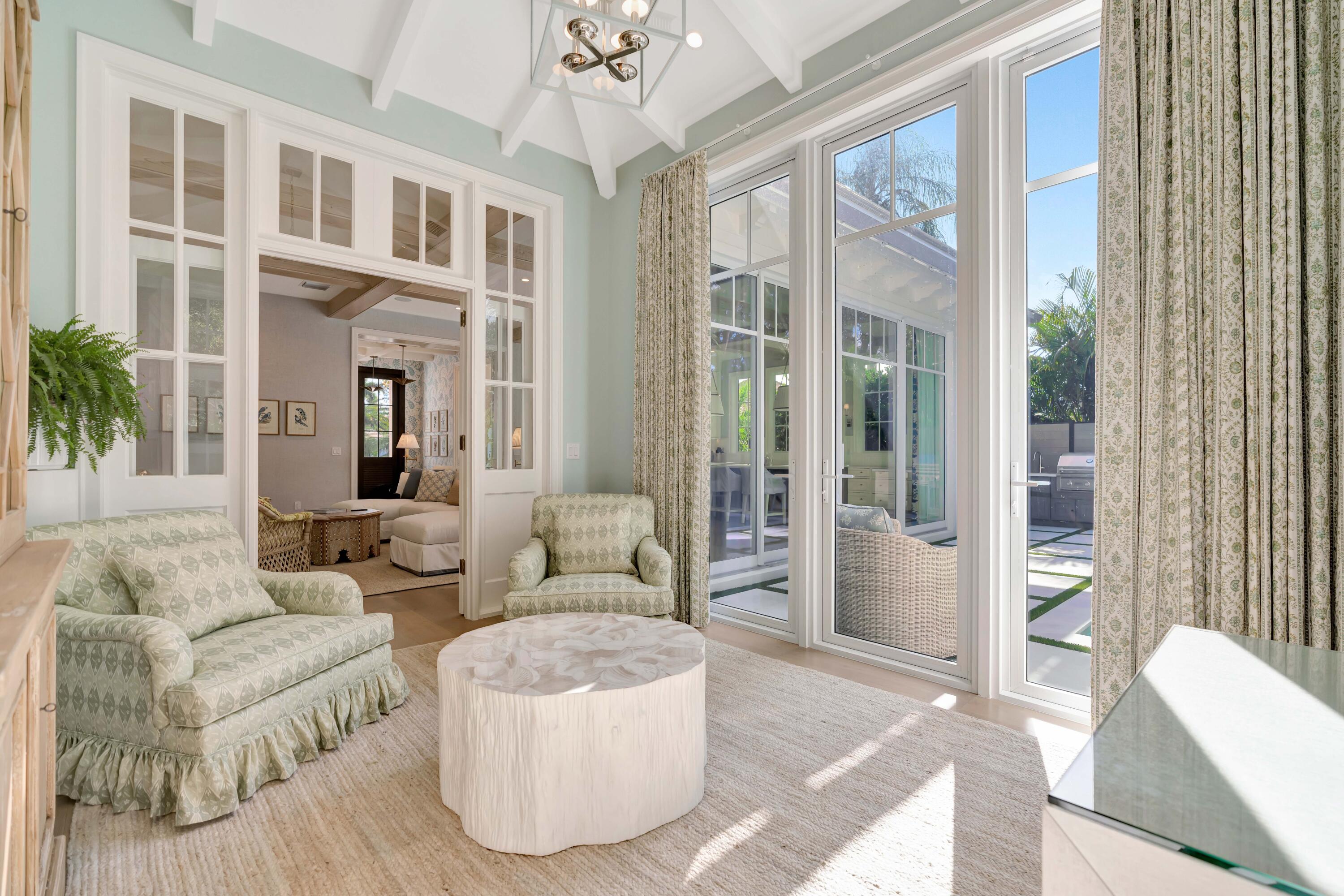 185 Birkdale Lane Jupiter, FL 33458 - Photo 23 of 64 a living room with furniture and a floor to ceiling window