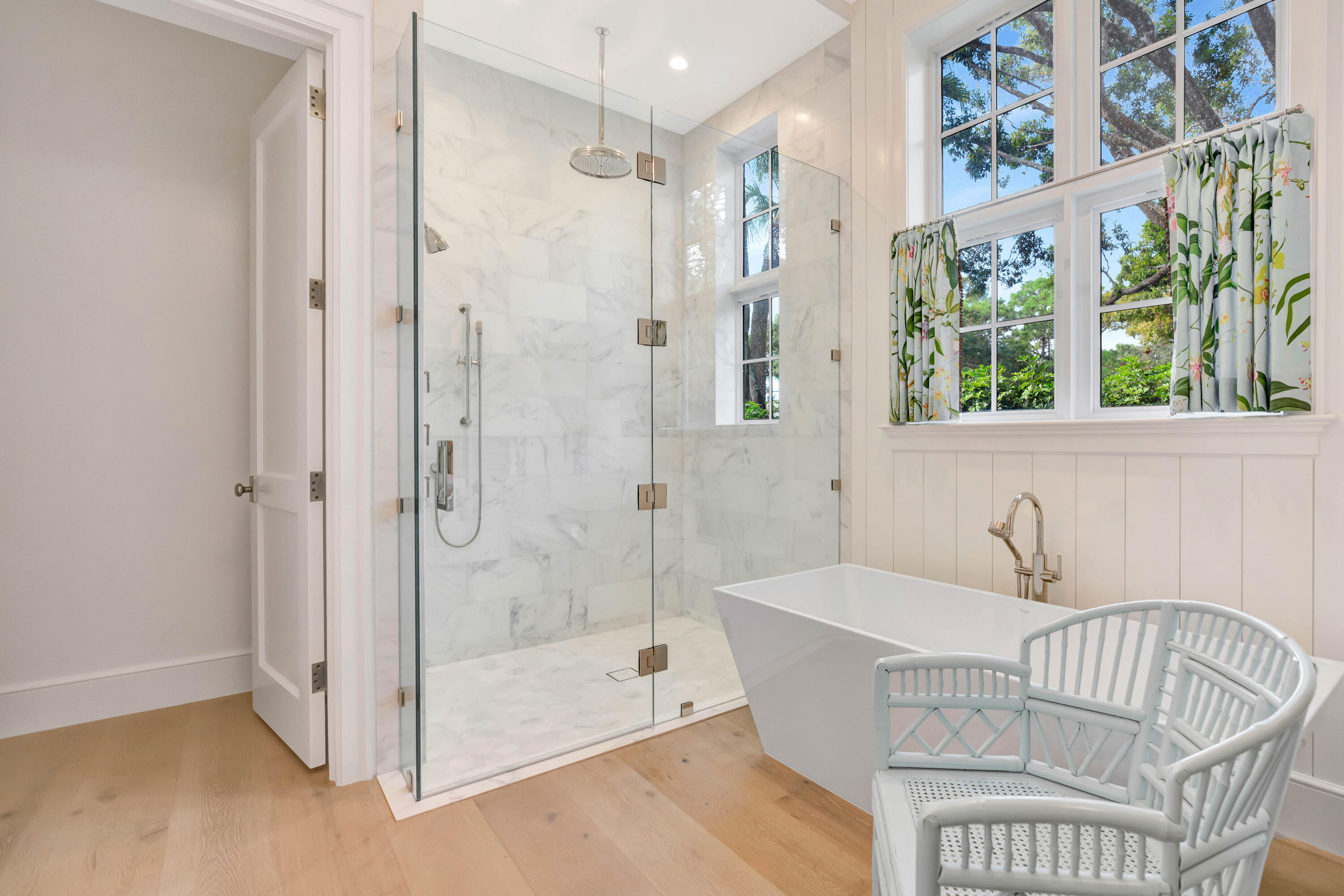 185 Birkdale Lane Jupiter, FL 33458 - Photo 28 of 64 a bathroom with a bathtub and a shower