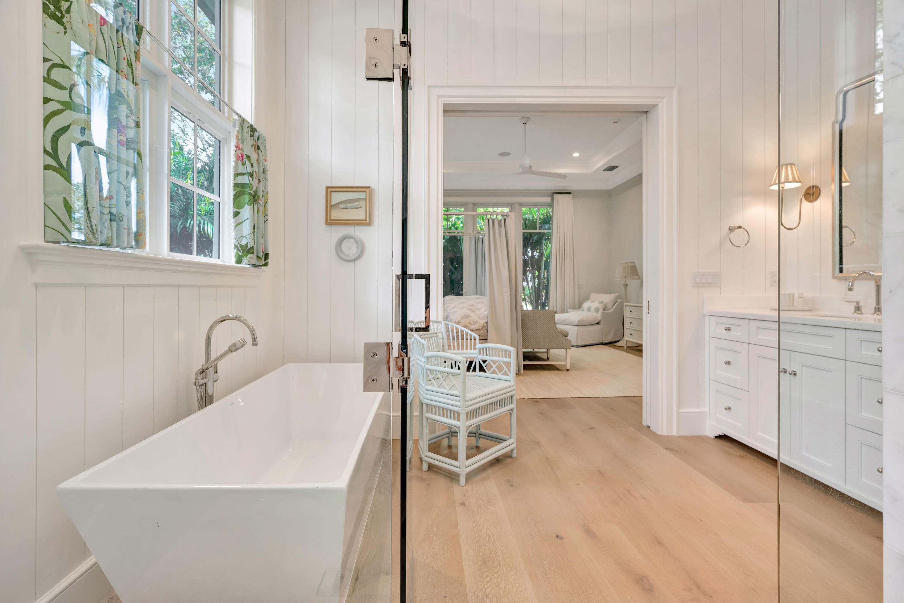 185 Birkdale Lane Jupiter, FL 33458 - Photo 29 of 64 a living room with furniture a large window and wooden floor