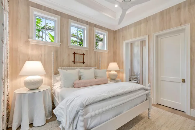 a bedroom with a large bed and a window