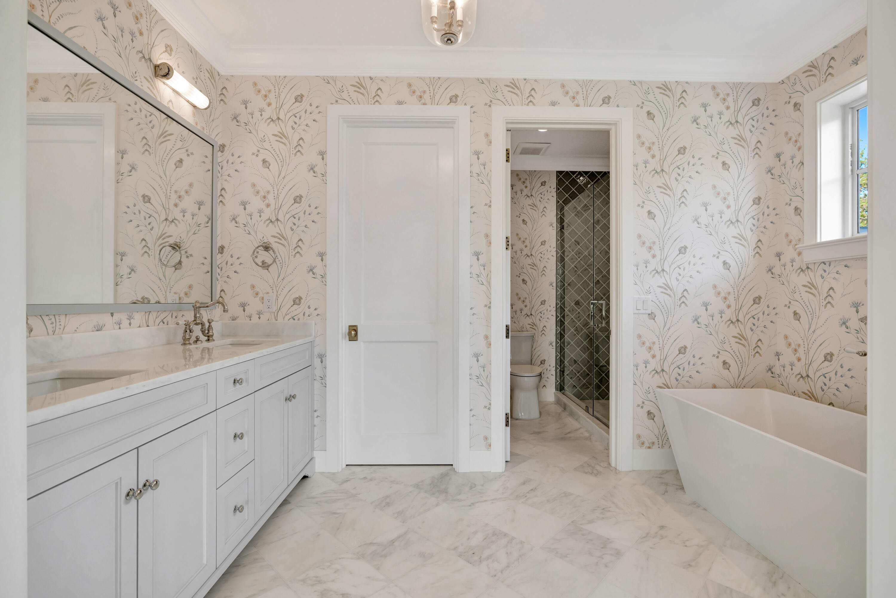 185 Birkdale Lane Jupiter, FL 33458 - Photo 47 of 64 a bathroom with a tub sink and mirror