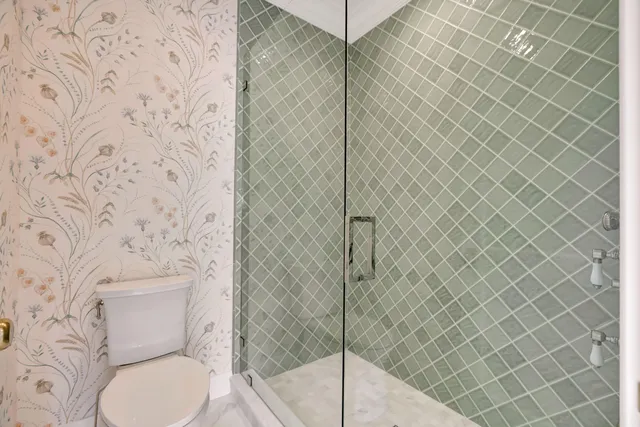 an aerial view of a residential houses with outdoor space and street view