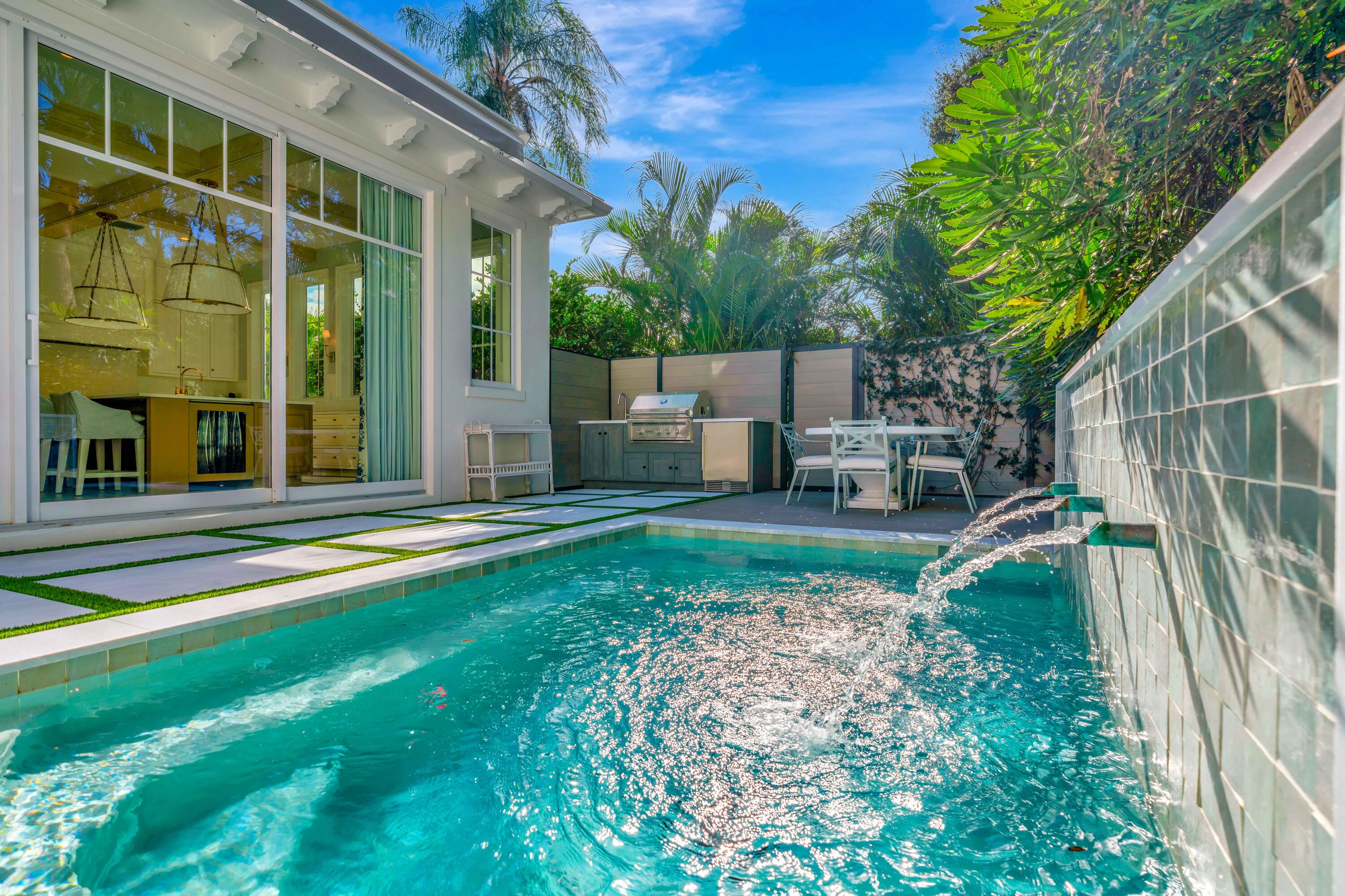 185 Birkdale Lane Jupiter, FL 33458 - Photo 54 of 64 a view of backyard with swimming pool and seating space