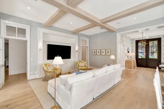 a living room with furniture fireplace and flat screen tv