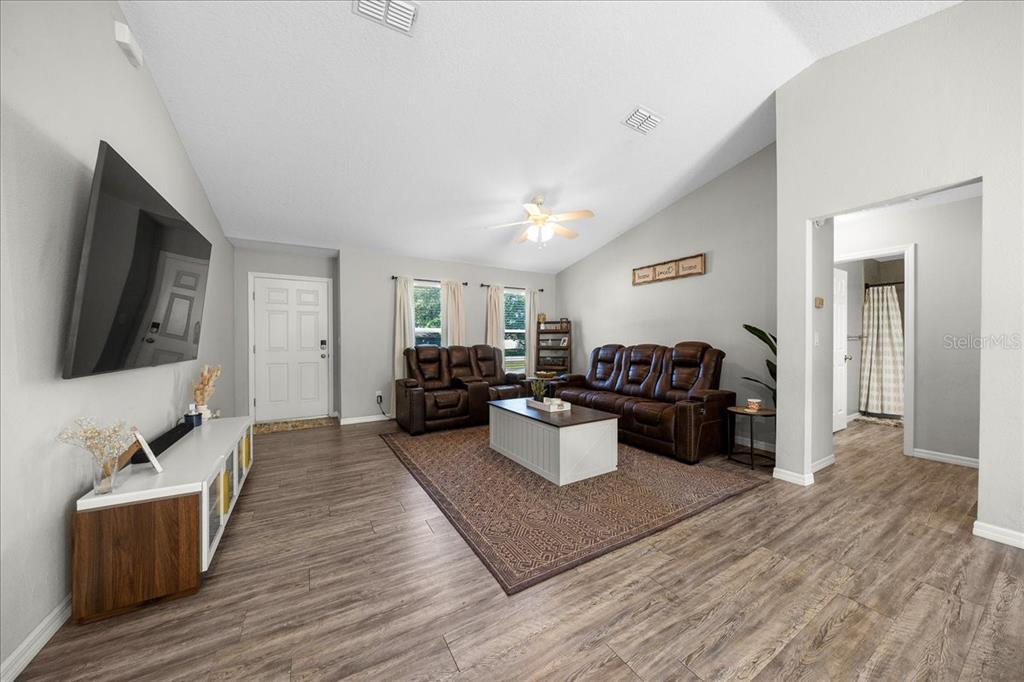 13 Teak Loop Place Ocala, FL 34472 - Photo 16 of 36 a living room with furniture and a flat screen tv