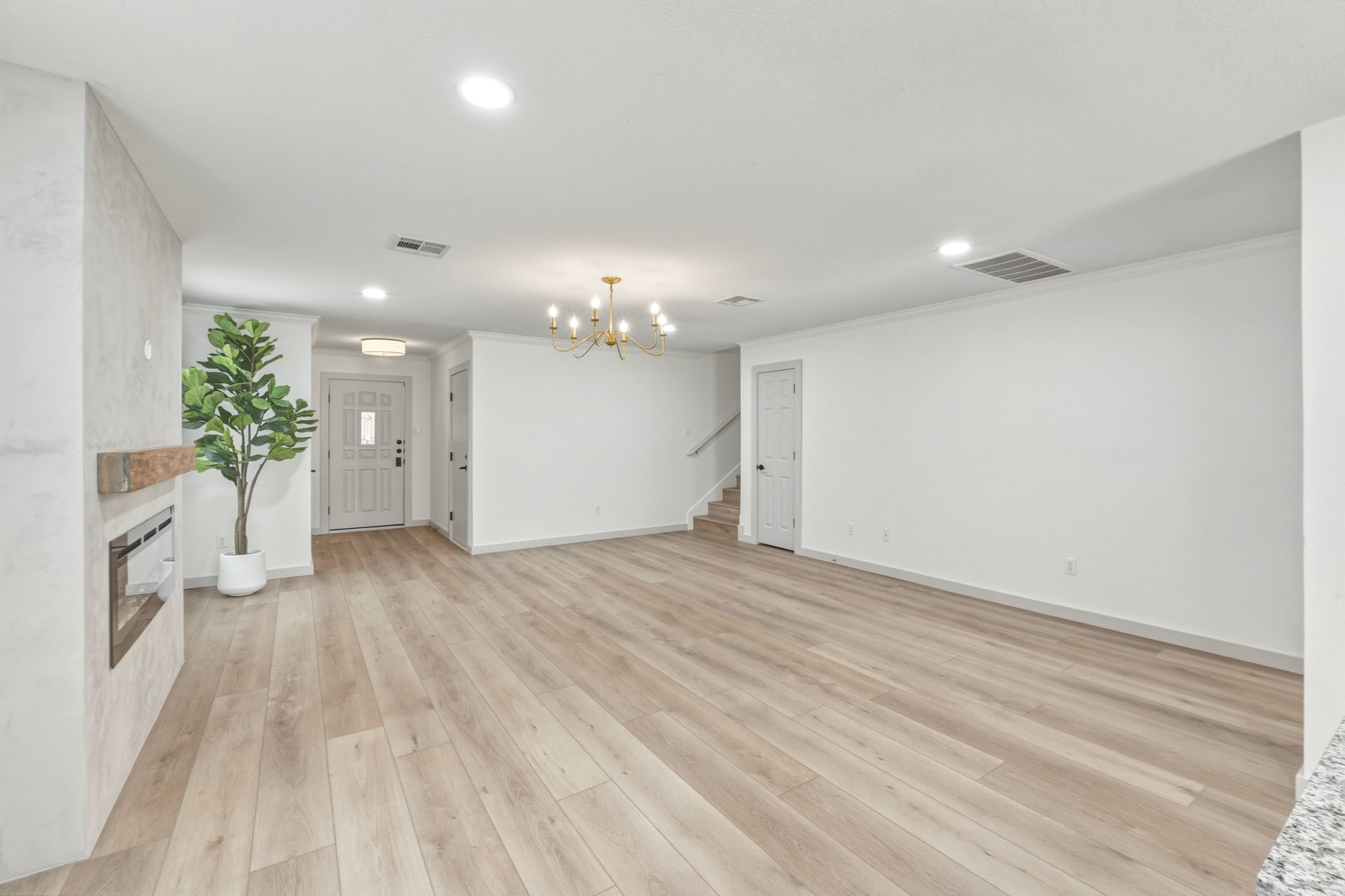 211 Banner Avenue Leander, TX 78641 - Photo 7 of 27 a view of an empty room and a kitchen
