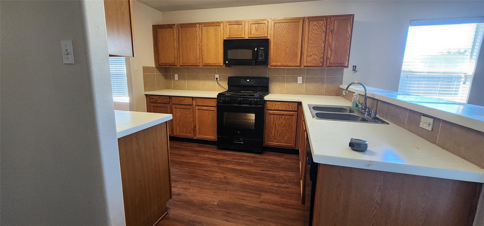 315 Sunset Colony Drive Rosharon, TX 77583 - Photo 6 of 20 a kitchen with stainless steel appliances granite countertop a stove a sink and a microwave