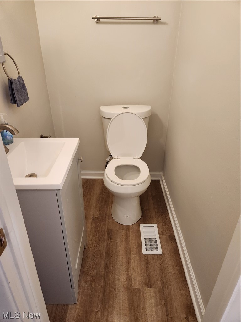 4660 West Farnhurst Road South Euclid, OH 44121 - Photo 16 of 17 Bathroom with vanity, toilet, and wood-type flooring