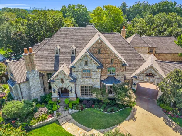 a aerial view of a house next to a yard