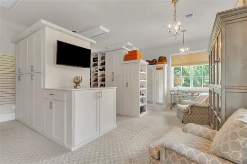 a bedroom with a bed and a table