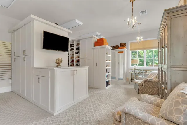 a bedroom with a bed and a table