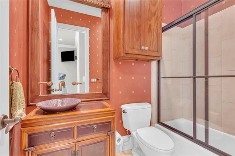 a bedroom with a bed and a table in it