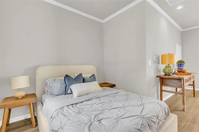 a large white kitchen with a granite countertop sink