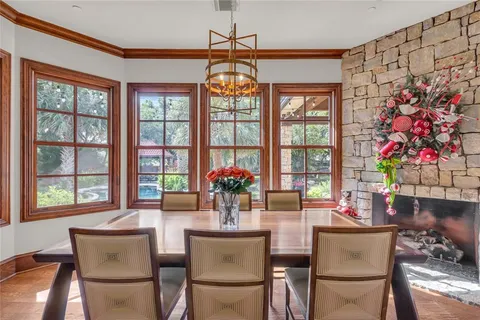 a living room with furniture a flat screen tv and a large window