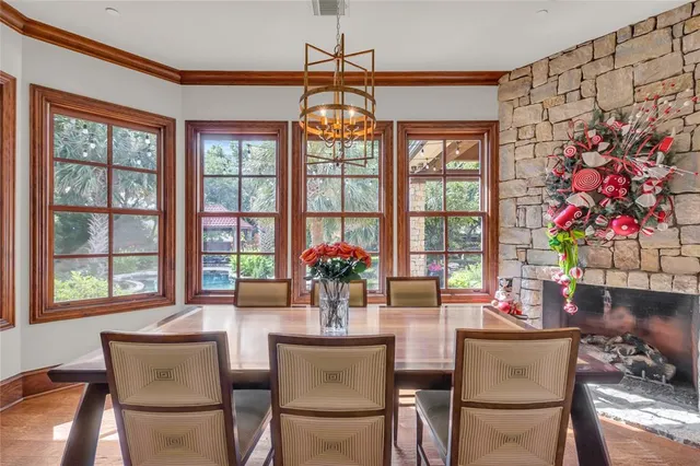 a living room with furniture a flat screen tv and a large window