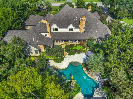 an aerial view of a house with a garden