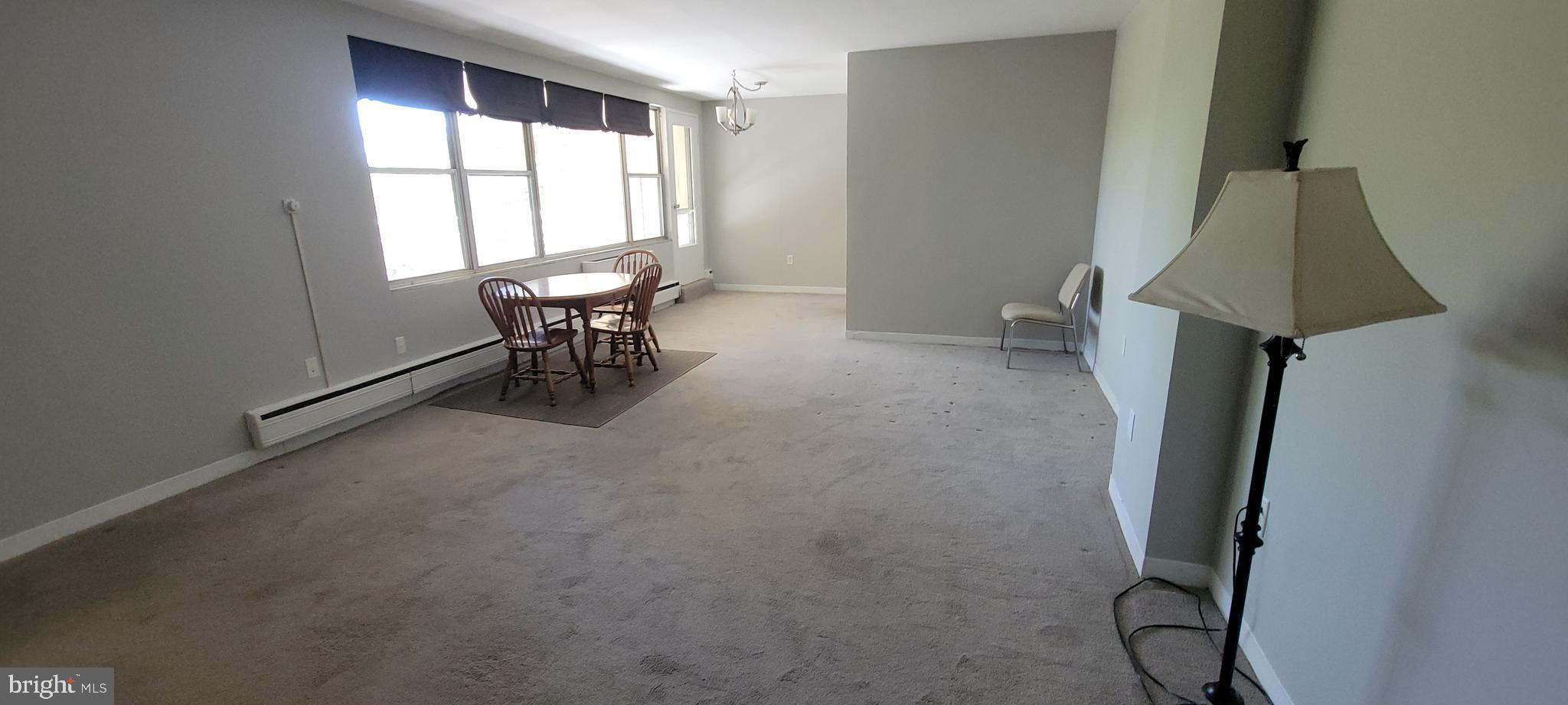 7900 Old York Road, Unit 505A Elkins Park, PA 19027 - Photo 3 of 12 a view of a workspace with furniture and a window