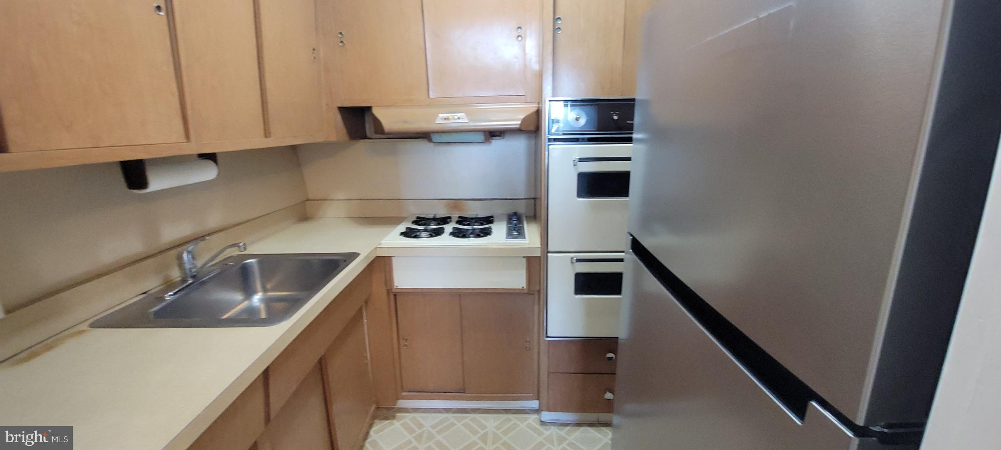 7900 Old York Road, Unit 505A Elkins Park, PA 19027 - Photo 5 of 12 a kitchen with a sink and cabinets