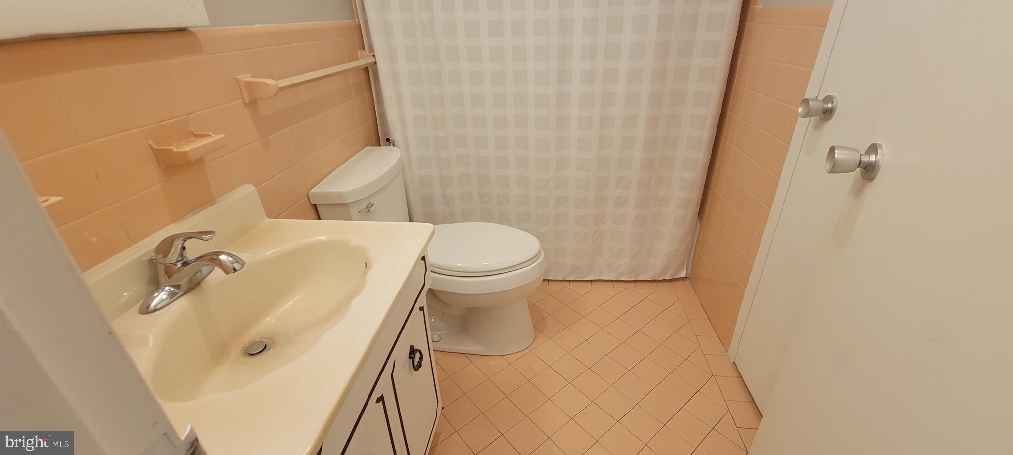 7900 Old York Road, Unit 505A Elkins Park, PA 19027 - Photo 10 of 12 a bathroom with a sink and toilet