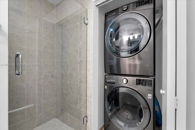 a bedroom with a balcony a bed and a flat screen tv