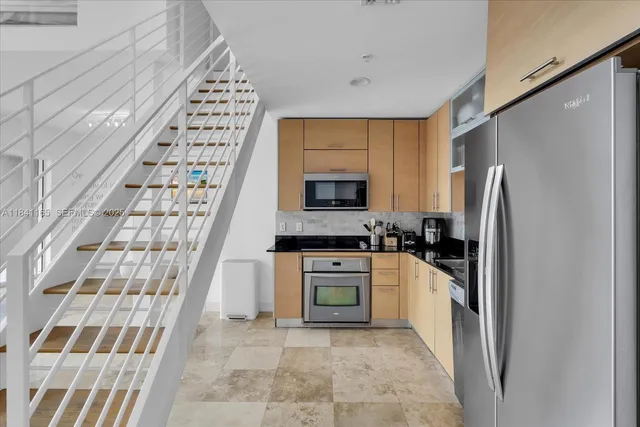 a view of a bathroom with a washer and dryer