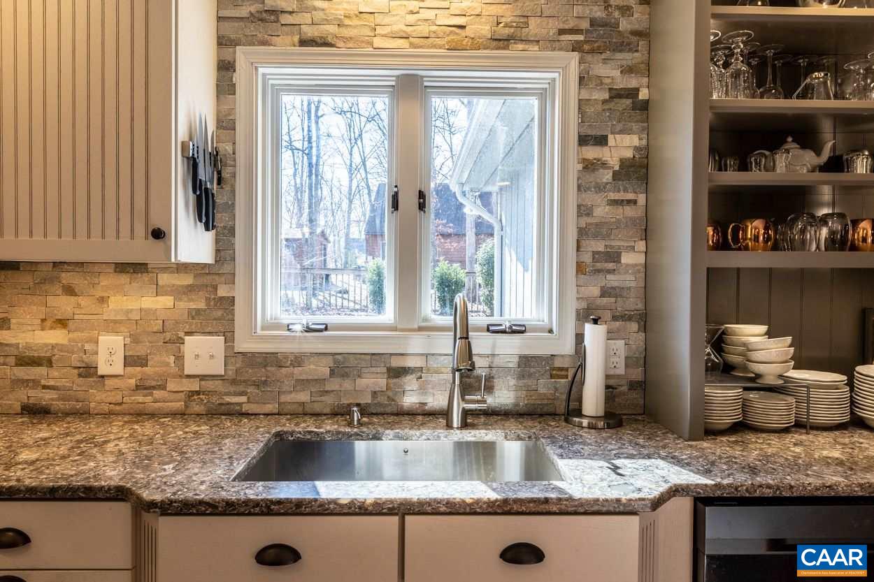 28 Colonial Road Palmyra, VA 22963 - Photo 12 of 40 a kitchen with granite countertop a sink and a window