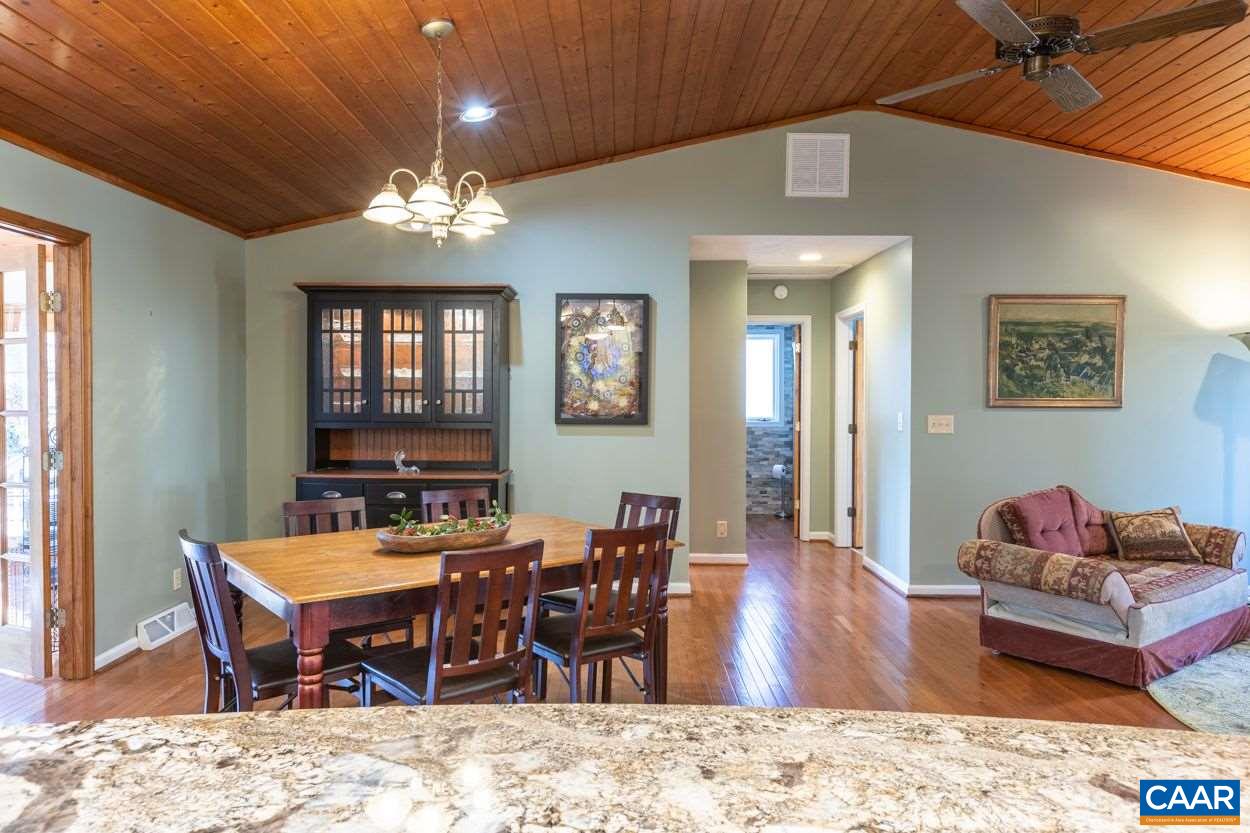 28 Colonial Road Palmyra, VA 22963 - Photo 13 of 40 a living room with furniture a chandelier and a dining room
