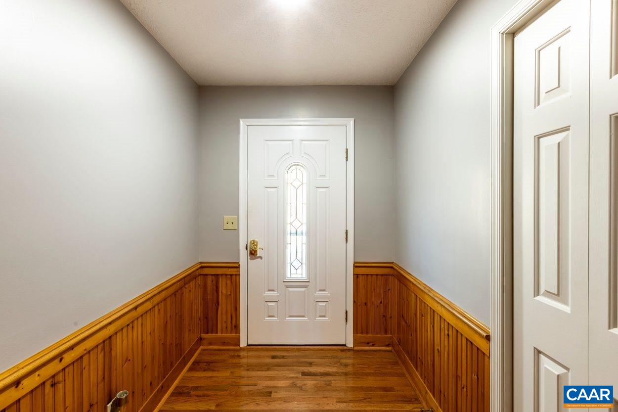 28 Colonial Road Palmyra, VA 22963 - Photo 29 of 40 a view of a hallway with wooden floor and staircase