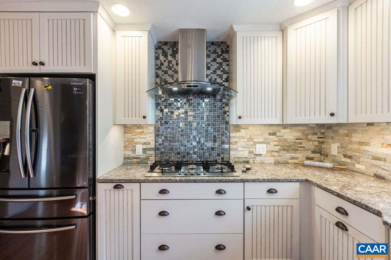 28 Colonial Road Palmyra, VA 22963 - Photo 6 of 40 a kitchen with stainless steel appliances granite countertop a refrigerator sink and cabinets