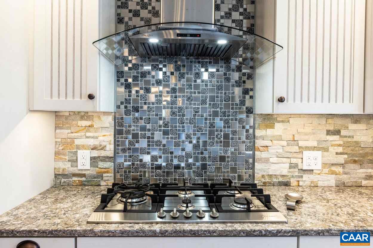 28 Colonial Road Palmyra, VA 22963 - Photo 7 of 40 a kitchen with a stove a sink and a window