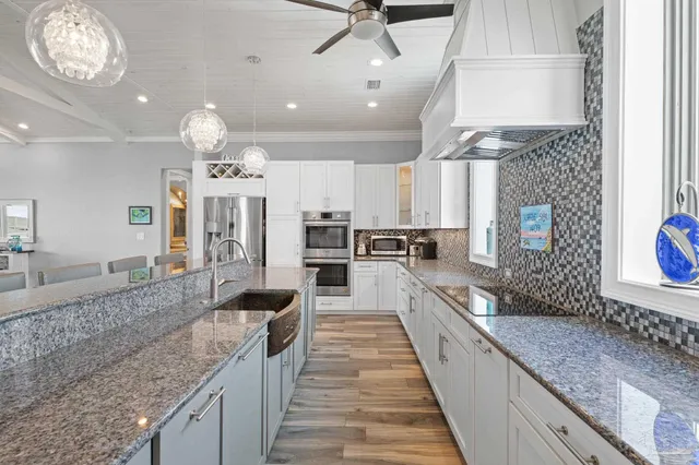 a bathroom with a granite countertop sink a mirror and a shower