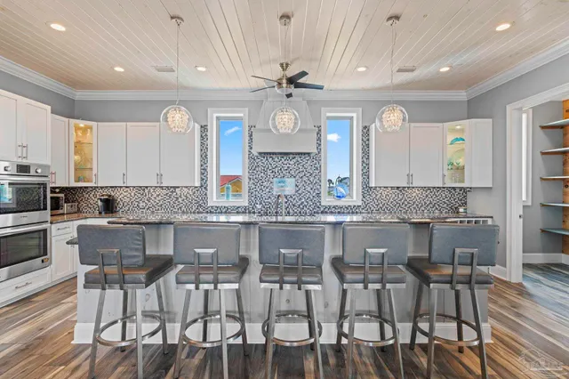 a bedroom with a large bed and a flat screen tv