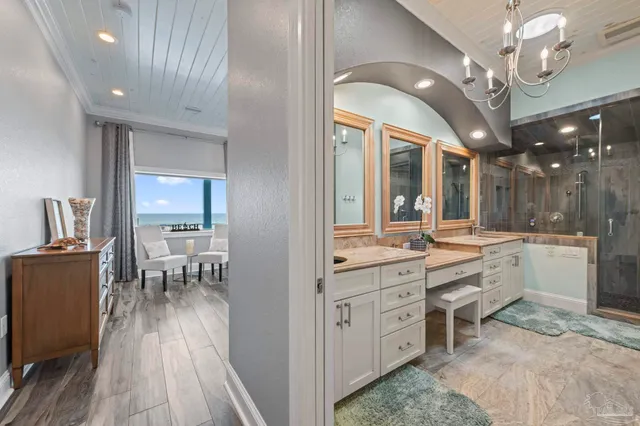 a spacious bedroom with a bed and a flat screen tv