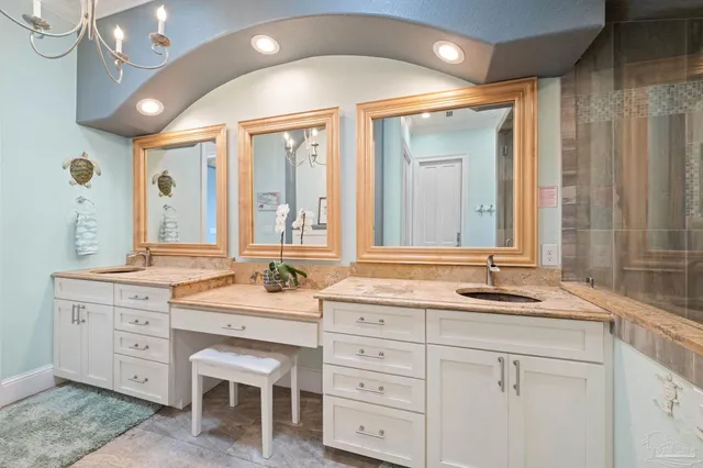 a dining room with furniture and a chandelier