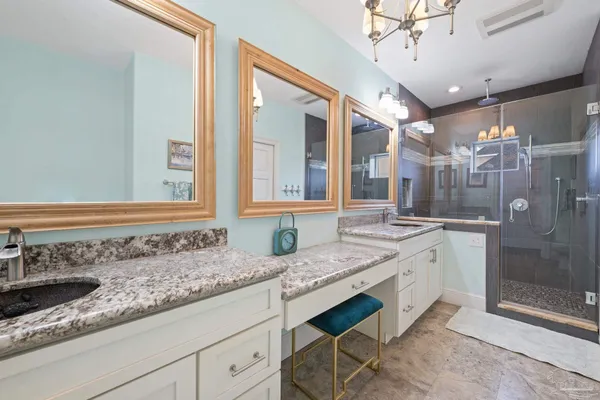 a kitchen with granite countertop a sink and cabinets