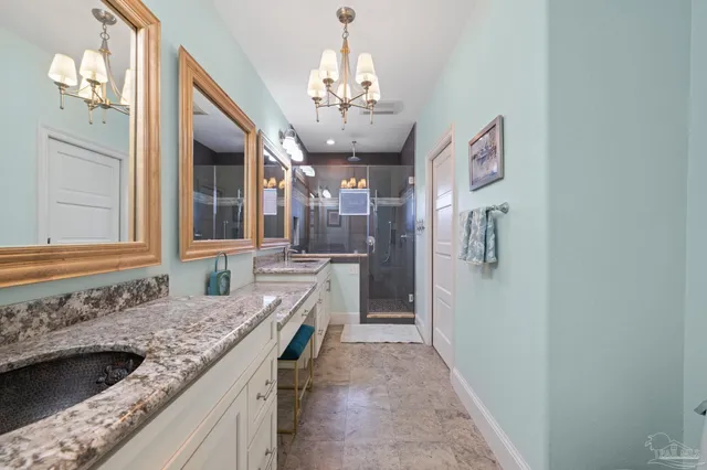 a bedroom with a bed and a flat tv screen on dresser