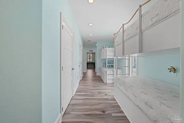a bed room with a bed and a mirror