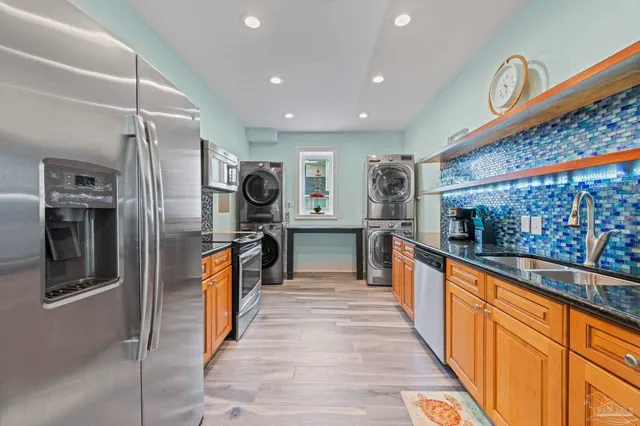 a dining room with furniture and a floor to ceiling window