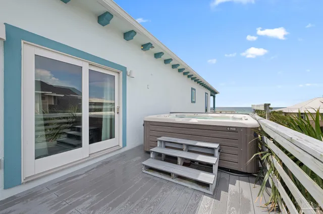 an aerial view of a residential houses with an outdoor space