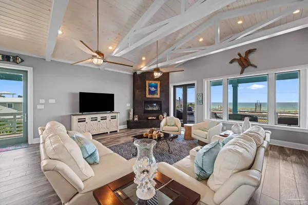 a living room with fireplace furniture and a flat screen tv