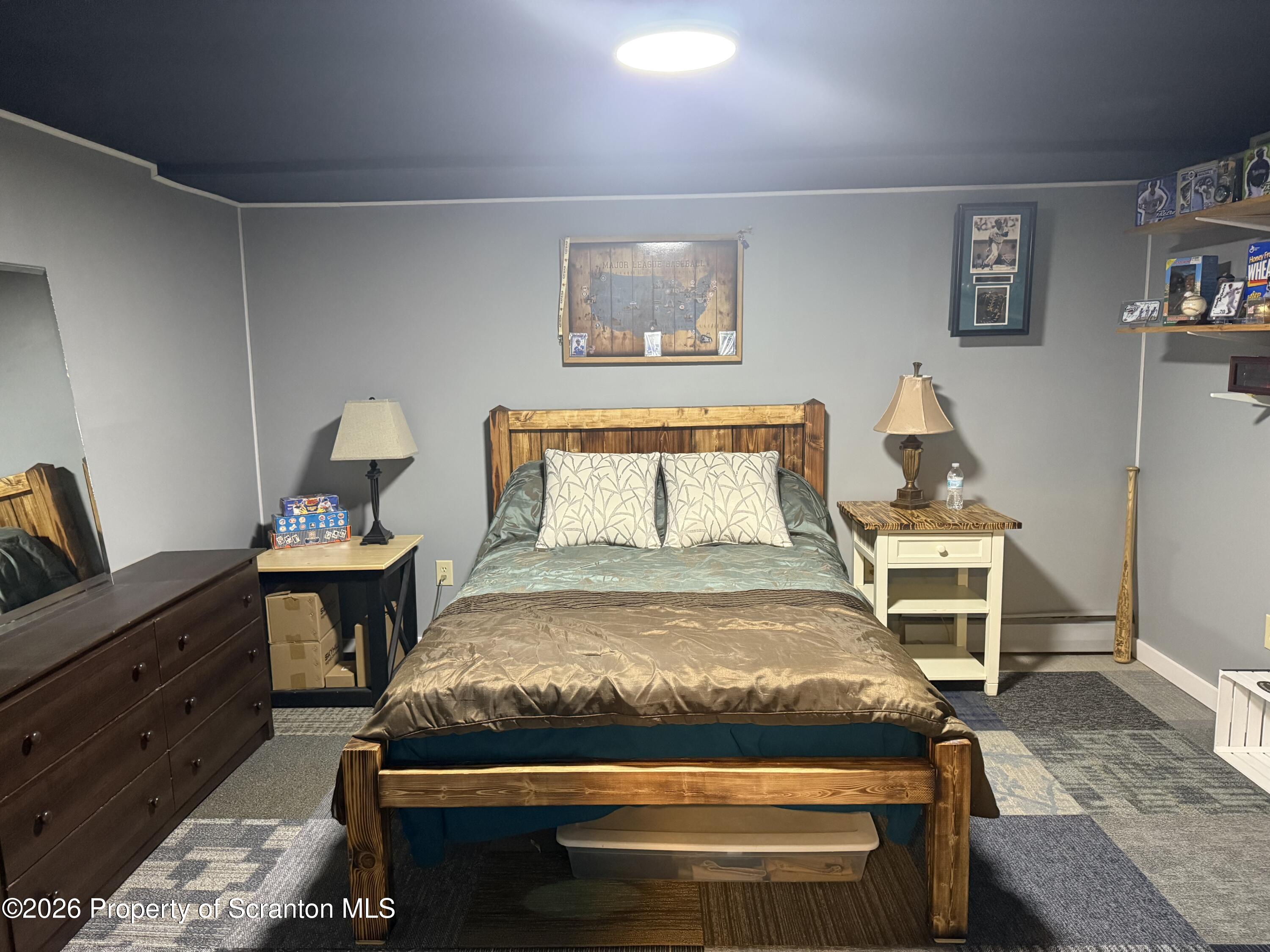 760 North Valley Avenue Olyphant, PA 18447 - Photo 14 of 34 a bedroom with a bed and wooden floor