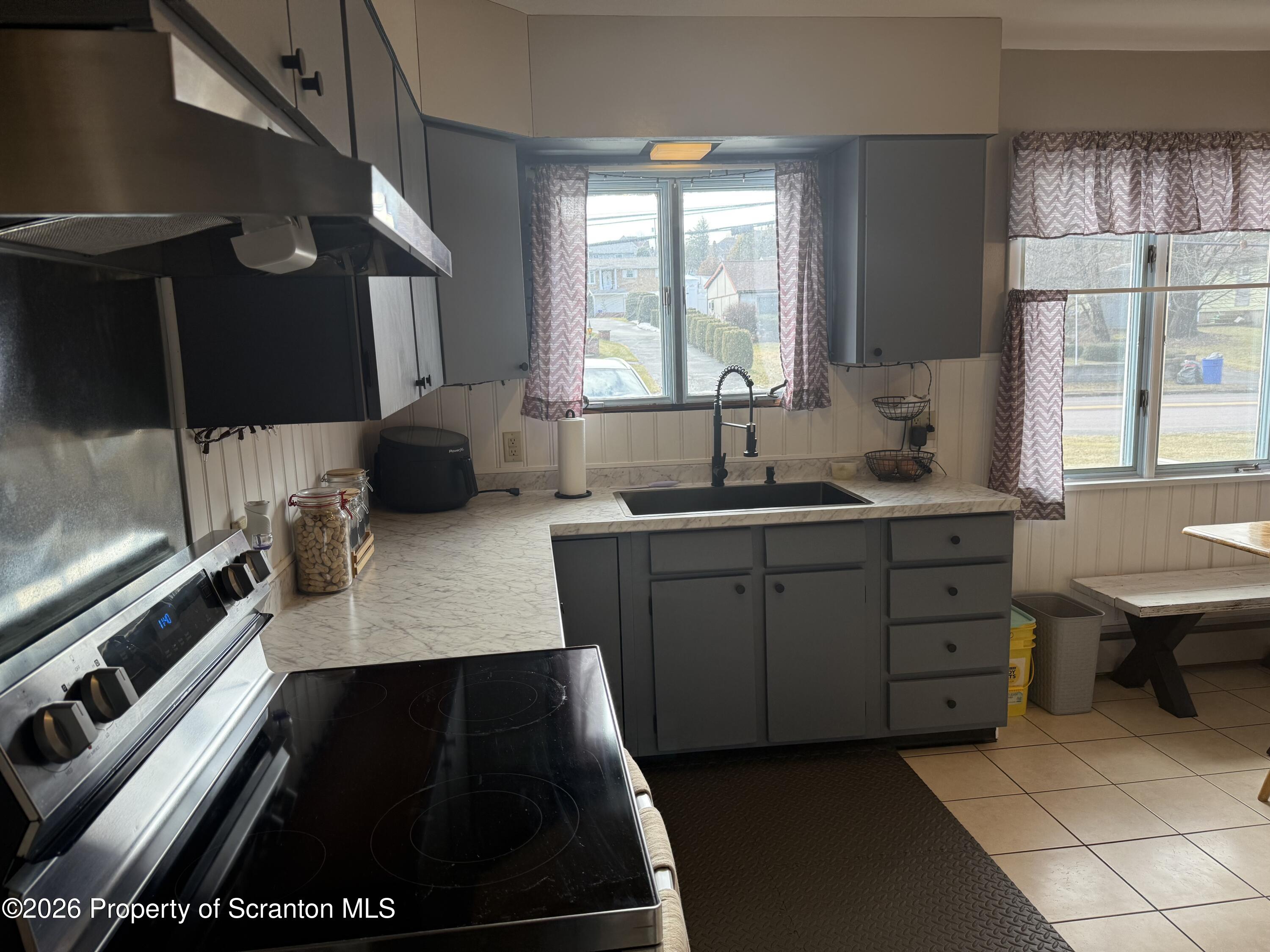 760 North Valley Avenue Olyphant, PA 18447 - Photo 2 of 34 a kitchen with a refrigerator and a sink