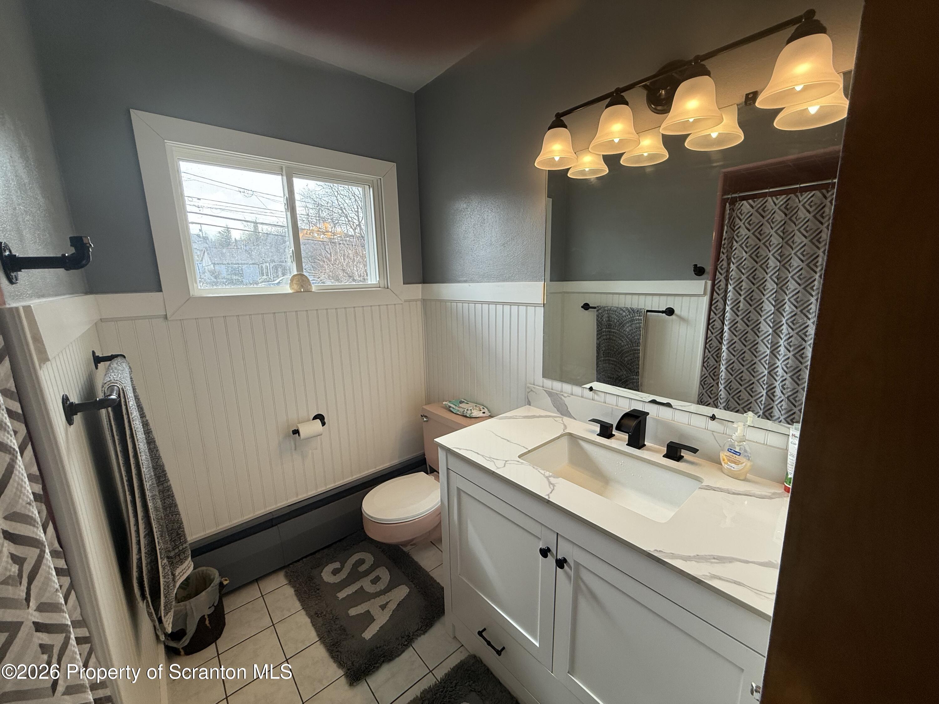 760 North Valley Avenue Olyphant, PA 18447 - Photo 10 of 34 a bathroom with a sink mirror vanity and toilet
