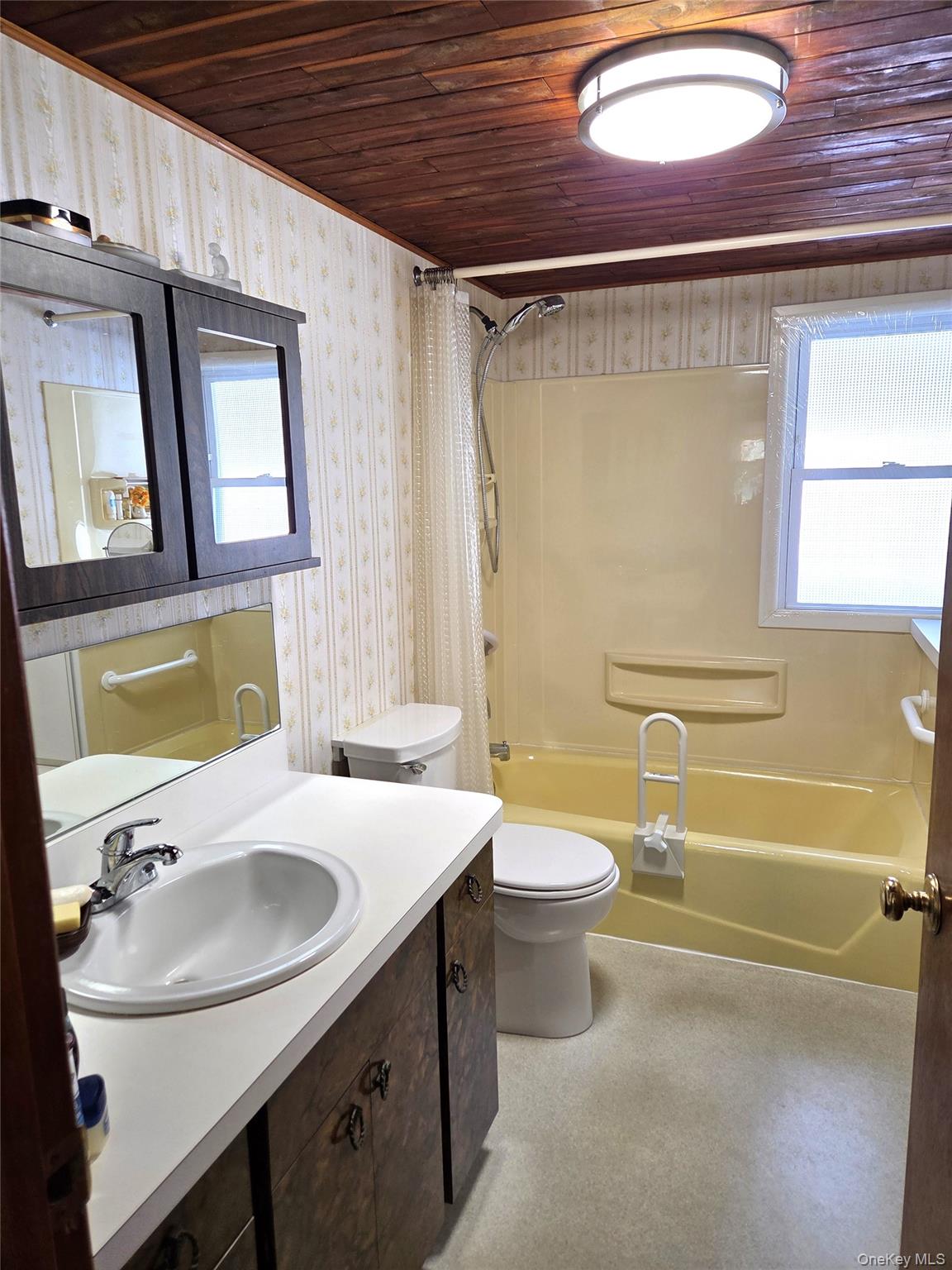 22 Hill Road St. James, NY 11780 - Photo 12 of 13 a bathroom with a sink and a mirror